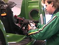 Servicing tractor mowers